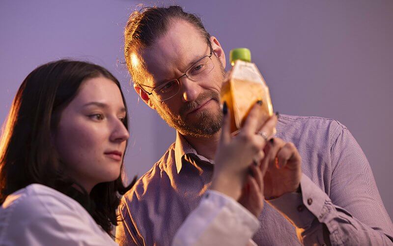 Physics student researcher Ashley Robinson and her faculty adviser Anton Peshkov, assistant professor of physics