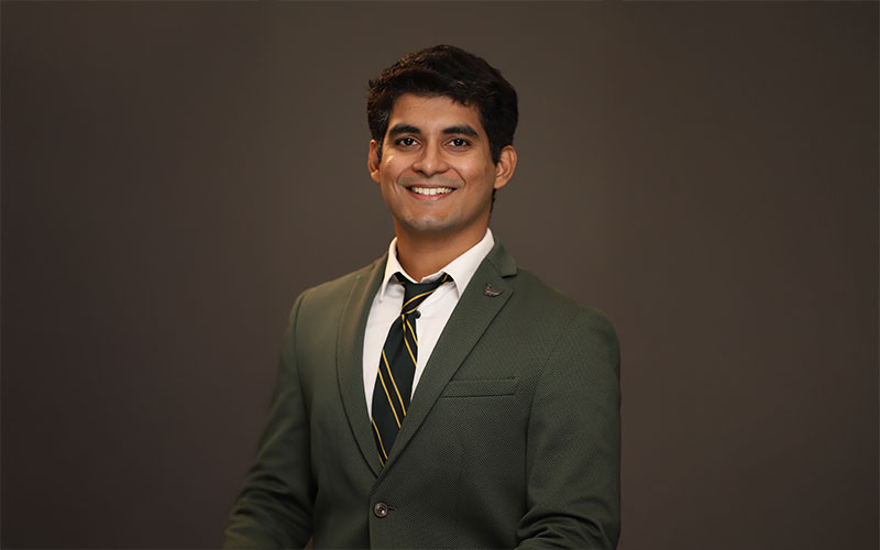 Professional headshot of Abhay Suresh Patil, dressed in business formal attire.