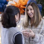 Cal State Fullerton lecturer Michelle Kurland speaks with a student.