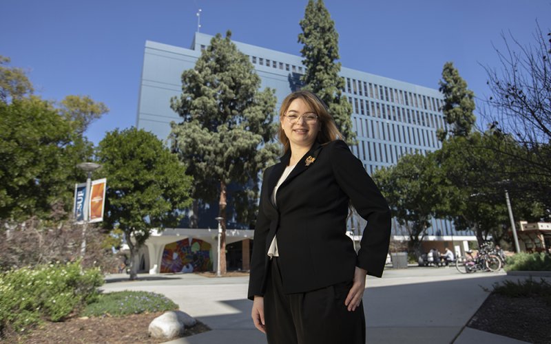 Natalya Rowe stands outside of the College of Humanities and Social Sciences.