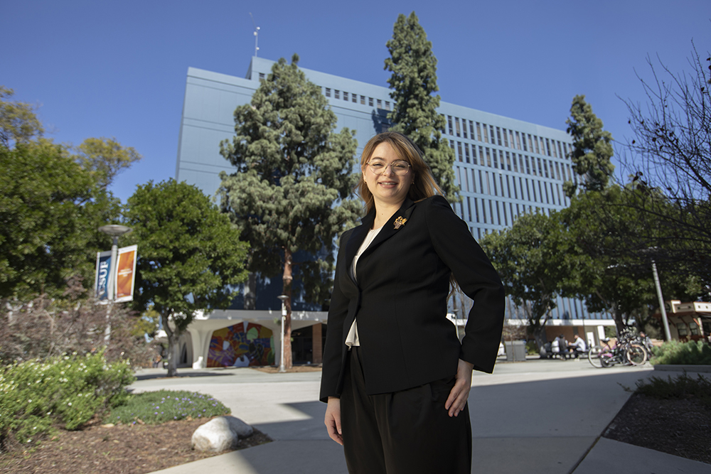 Natalya Rowe stands outside of the College of Humanities and Social Sciences.