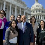 Cal State Fullerton President Ronald Rochon and a university delegation