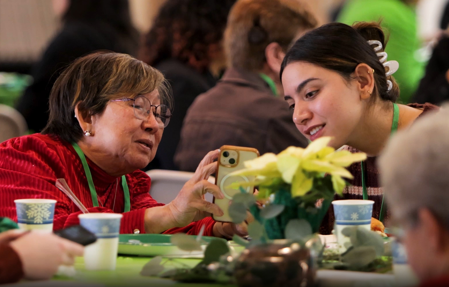 A student interacts with an older adult at a Project Life event.