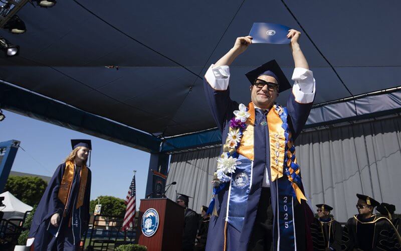 Graduate celebrates with degree