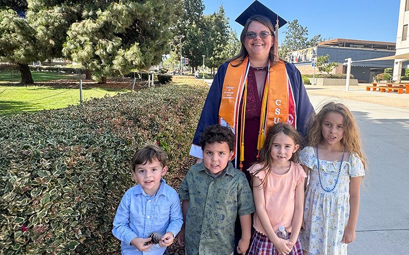 Jessica Castillo at CSUF Commencement 2025 with her kids.
