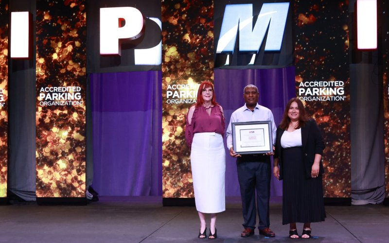 Elissa Thomas, Reggie Turnbow, and Monica Chavez accept the IPMI accreditation plaque.