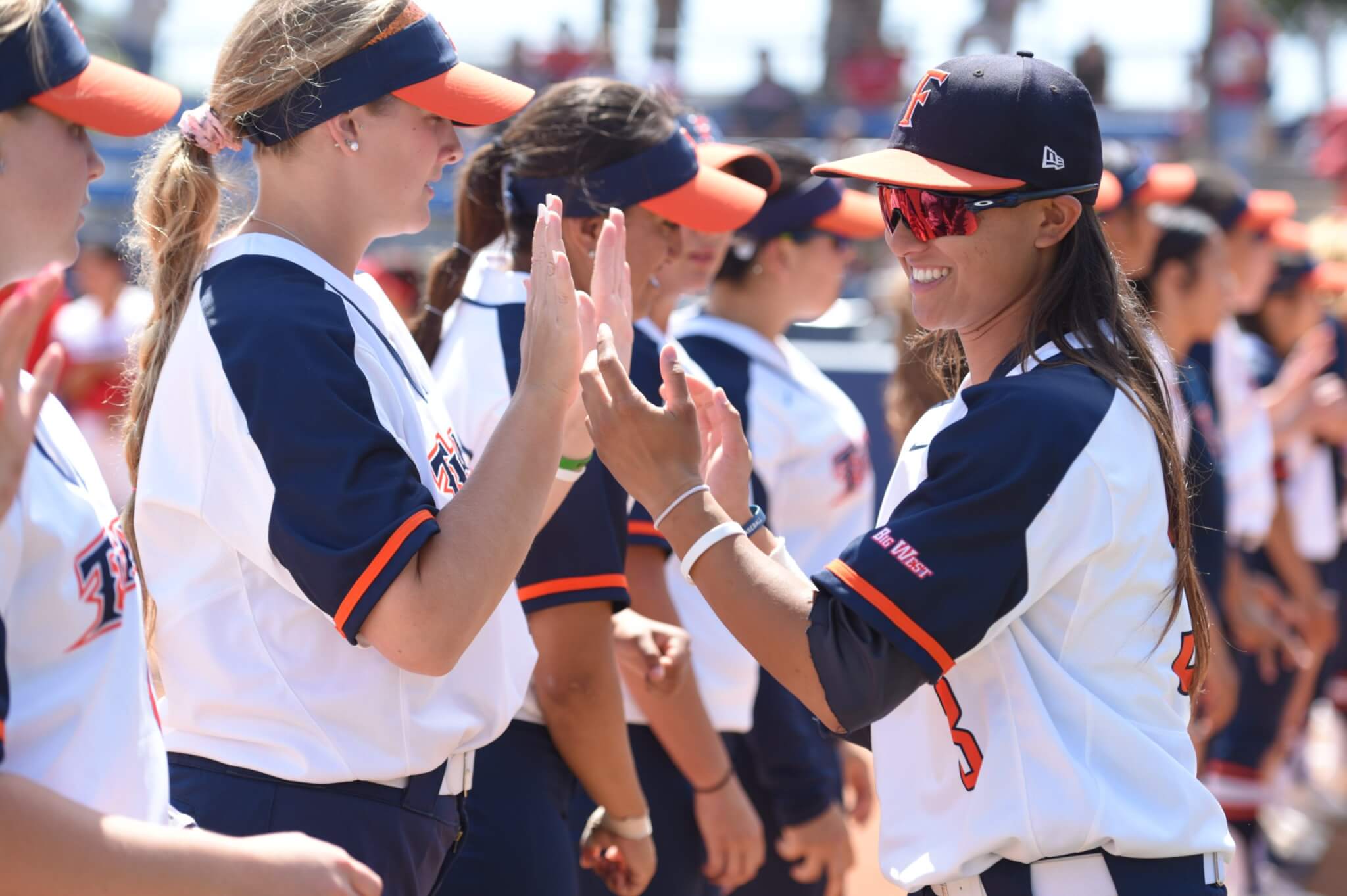 Kelsie Whitmore celebrates with the Titans Softball team.