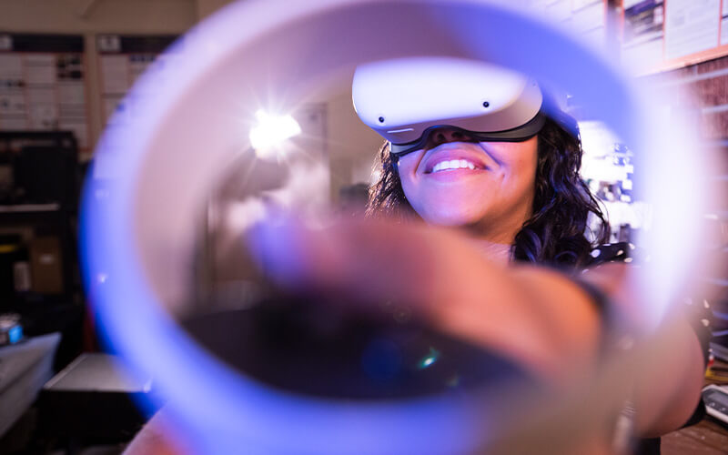 Wendy Joya with Virtual Reality VR headset as part of her biomanufacturing research