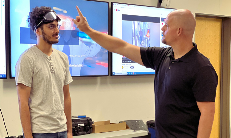 A CSUF Police Department officer demonstrates a field sobriety test with a member of the CSUF Police Department Community Police Academy.
