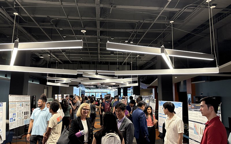 Students present their research posters at the Titan Supercomputing Center Research Symposium in the Pollak Library.
