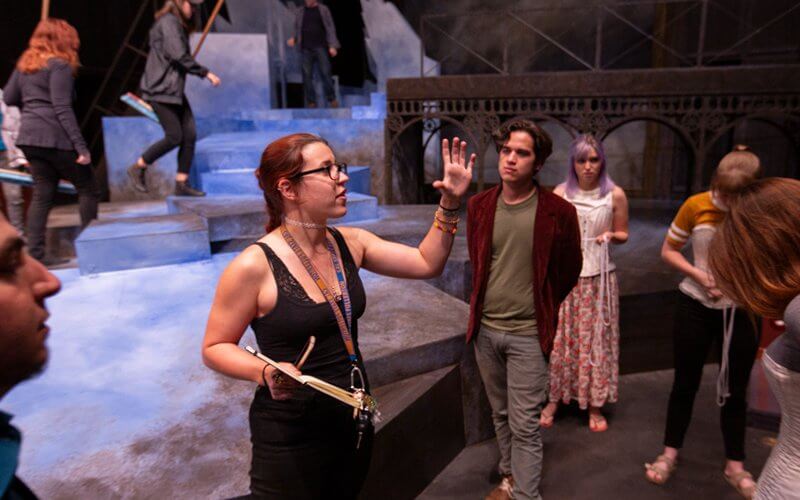 Student Director Leads Play on set