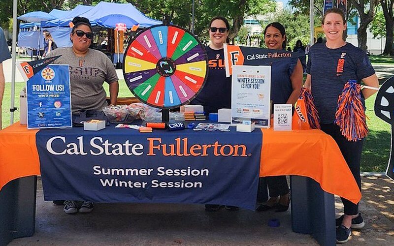 University Extension team hosts a tabling event on the CSUF campus.