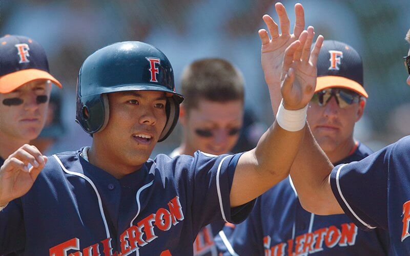Kurt Suzuki high-fiving teammates