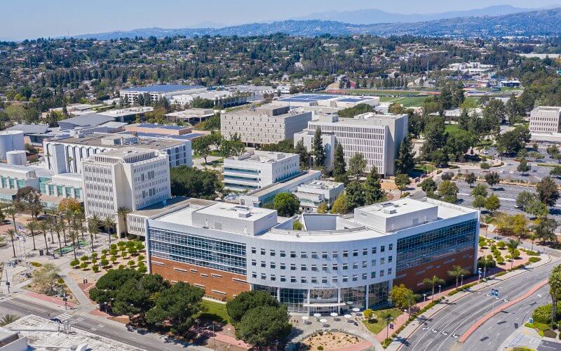 Aerial view of Mihaylo Hall and CSUF Campus