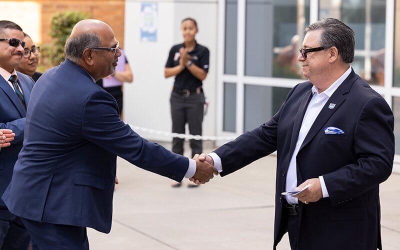 Sri Sundaram shakes Jerry Conrey's Hand