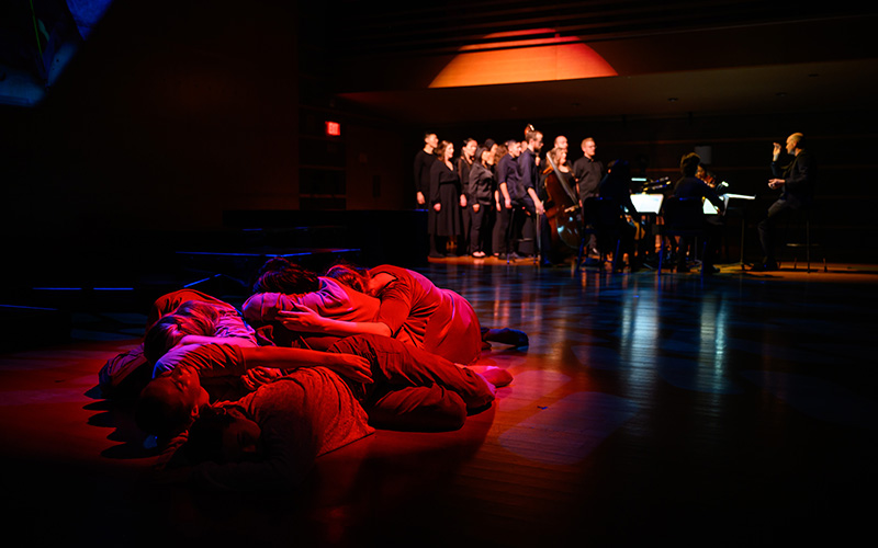 Dancers and singers perform “To the Hands” on stage.