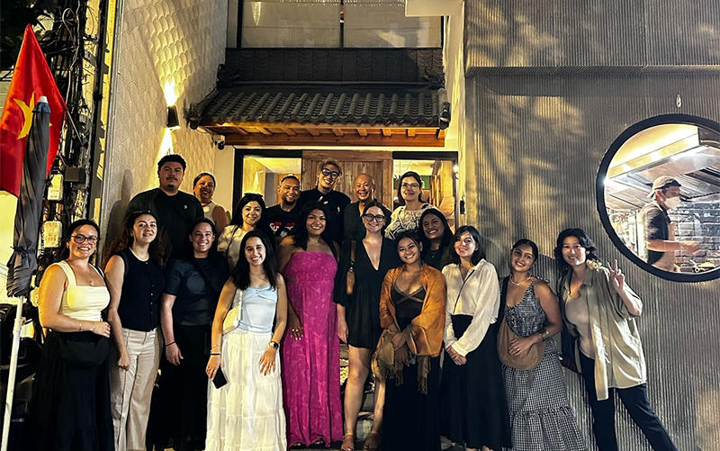 CSUF students stand outside of a restaurant during a summer study abroad trip to Vietnam.