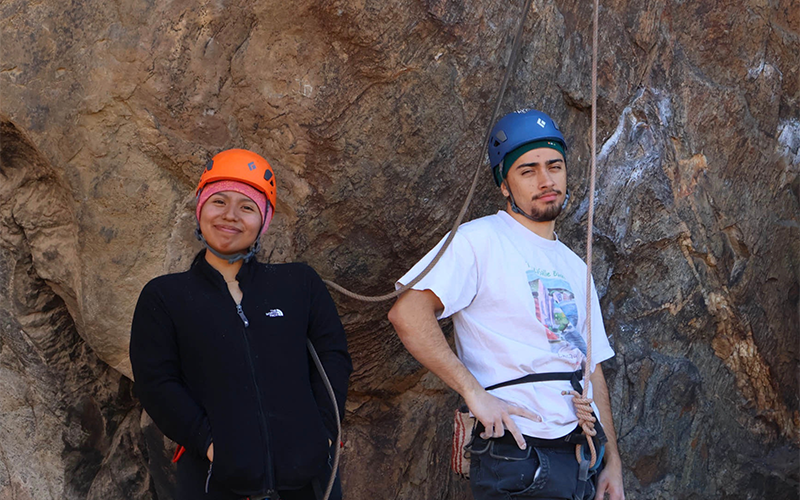 Mia Castro-Rodriguez and Rodrigo Garcia Hernandez prepare to guide fellow Titans on a climb.