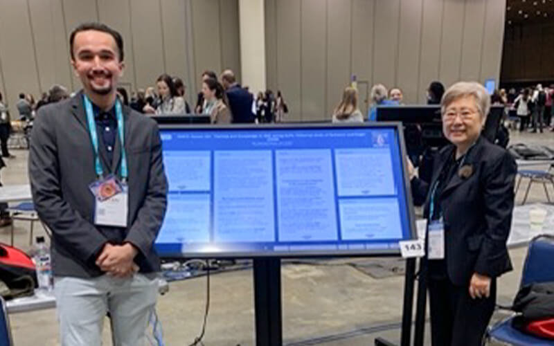 Ryan Nadler and HyeKyeung Seung present research.