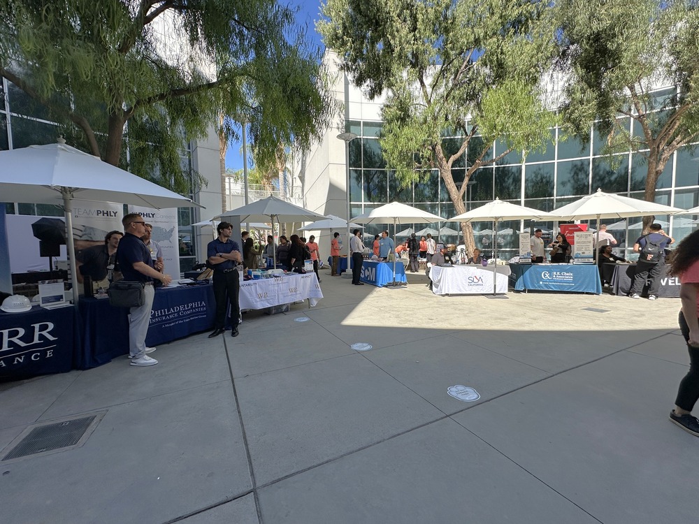 Industry professionals talk to students at the 2025 iDay career fair event.