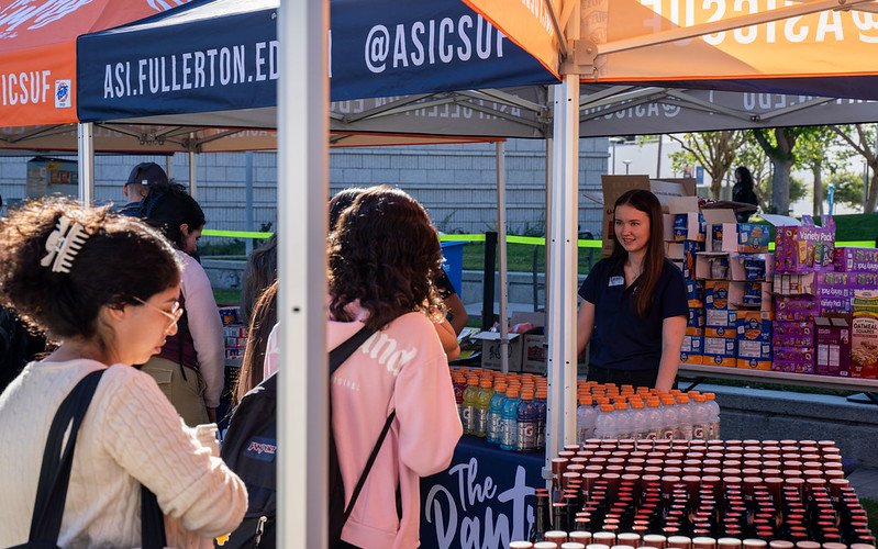 Students line up to receive snacks and drinks at ASI Food Pantry's "Snack and Go" event.