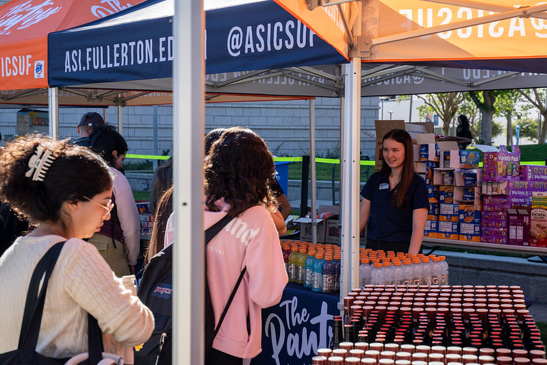 Students line up to receive snacks and drinks at ASI Food Pantry's "Snack and Go" event.