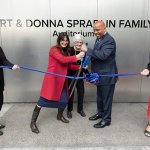 Donna Spradlin and CSUF leaders cut a ribbon at the naming ceremony for the Kirt and Donna Spradlin Family Auditorium