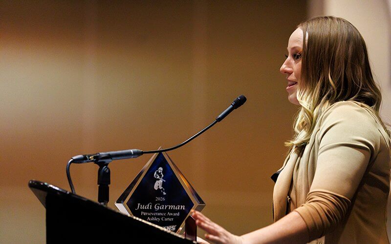 Ashley Carter speaks at a podium in the Titan Student Union.