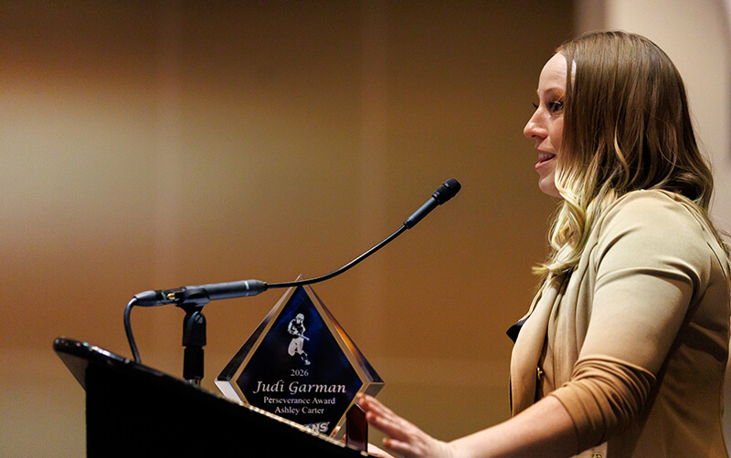 Ashley Carter speaks at a podium in the Titan Student Union.