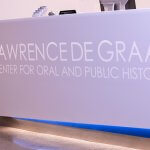 A sign that reads "Lawrence de Graaf Center for Oral and Public History"