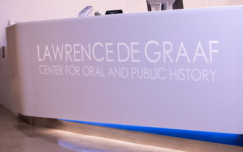 A sign that reads "Lawrence de Graaf Center for Oral and Public History"
