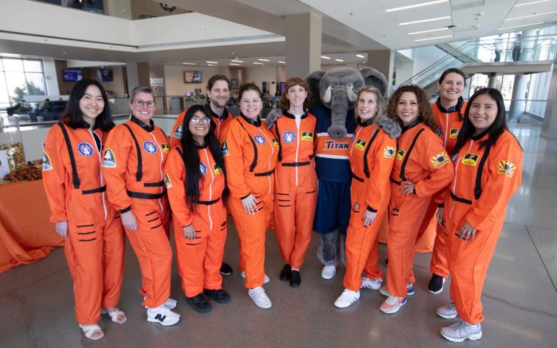 University Advancement staff members pose for a group photo with Tuffy at Titans Give