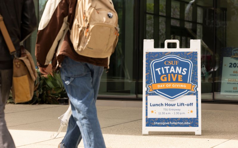 Titans Give Lunch Hour Lift-Off event signage on campus