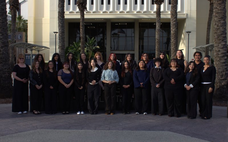 Comm Week student team poses for a group photo outside of Langsdorf Hall.