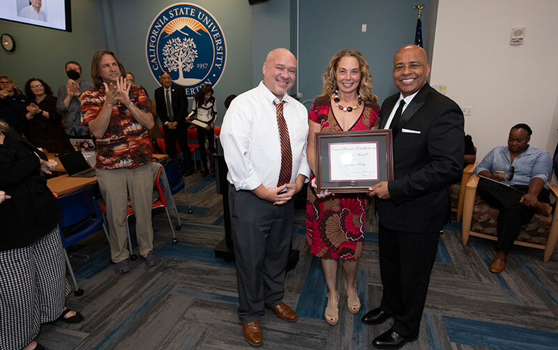 Jason Shepard, Cynthia King and  Ronald Rochon pose with award at the April 23 Academic Senate meeting.
