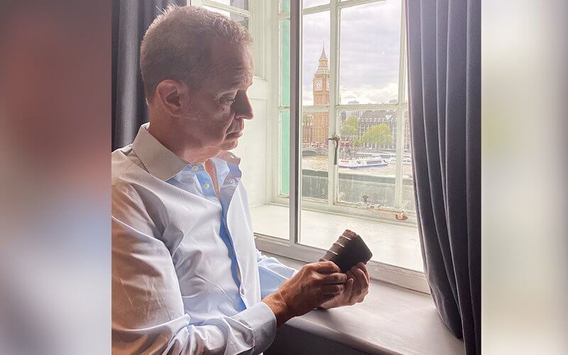 Professor Marlin E. Blaine holds a book