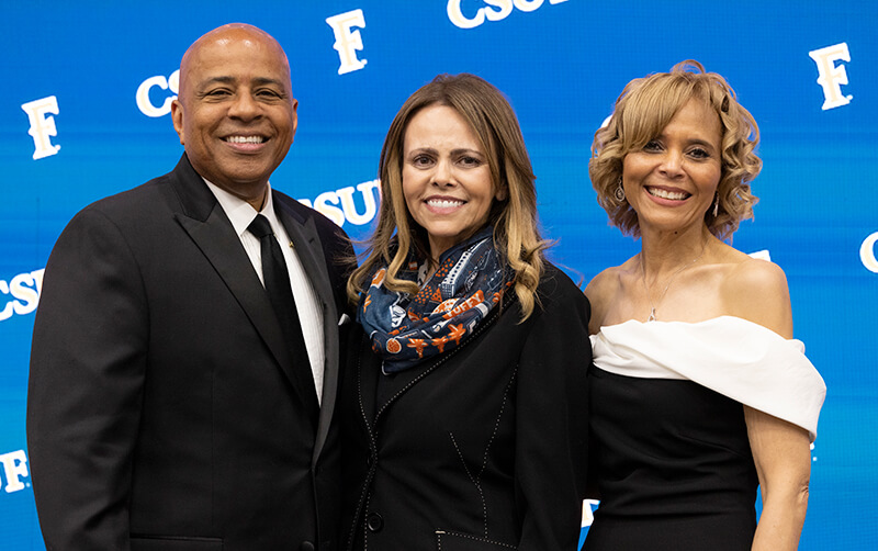 Ronald Rochon, Marissa Sherb and Phenicia McCullough on stage at the 2026 University Awards Program
