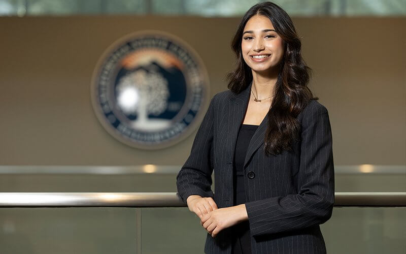 Haneefah Syed in front of the Associated Students Inc. chambers