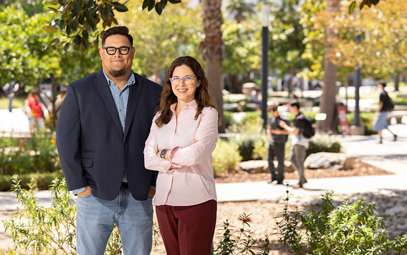 Mario Obando stands next to Gabriela E. Nuñez on the CSUF campus. 