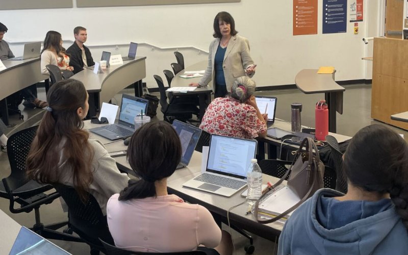 Shannon Alter, IREM national instructor, speaks to students in a classroom.