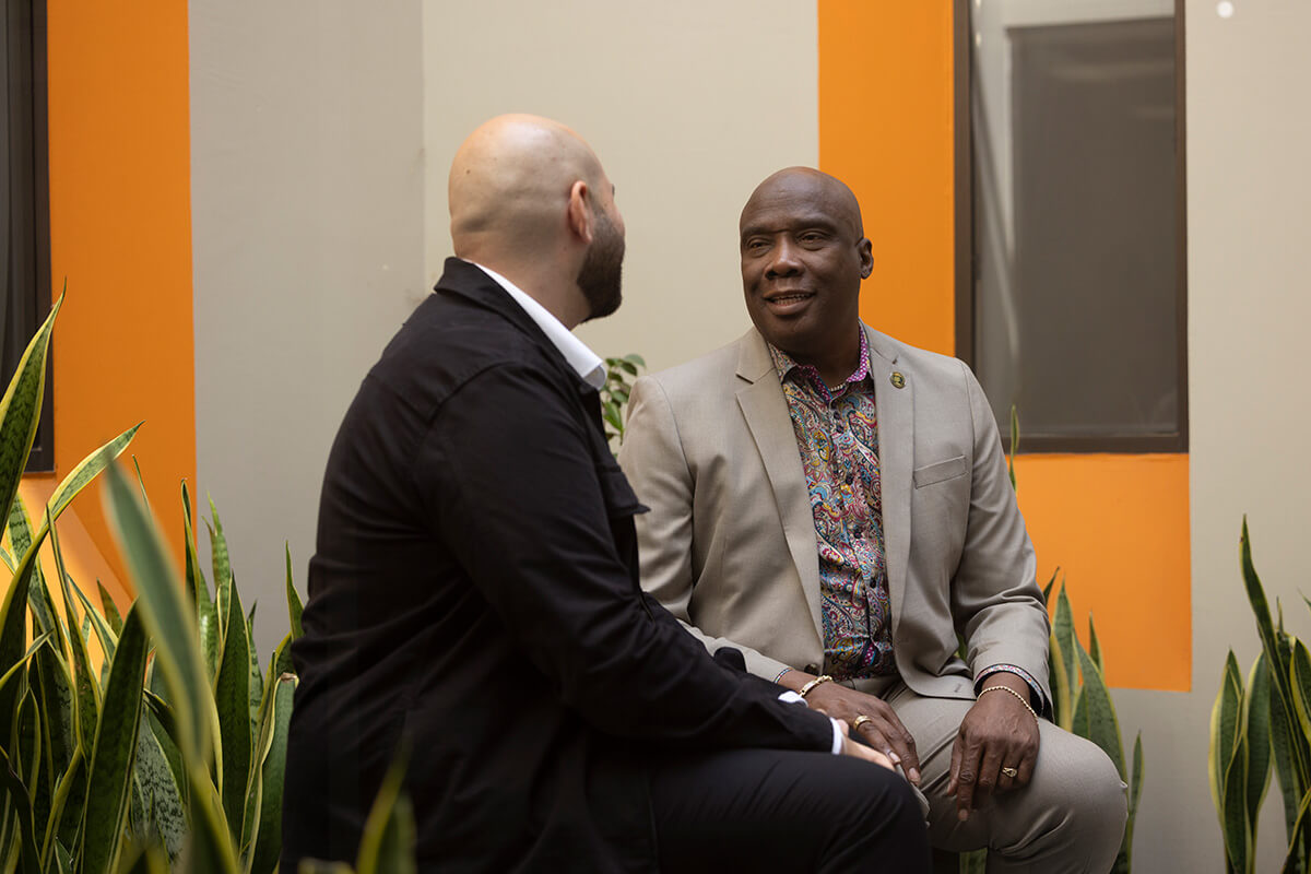 Austin Nation, associate professor of nursing, speaks to a student
