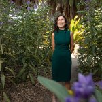Joya Salas stands in flower field at the Arboretum and Botanical Garden at Cal State Fullerton
