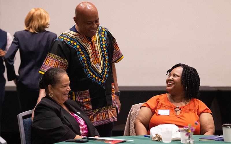 CSUF President Ronald Rochon speaks to guests at the CSU Juneteenth 2026 Symposium watch party event.