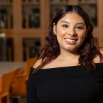Biological science student Lexys Salcido stands in a biology classroom.