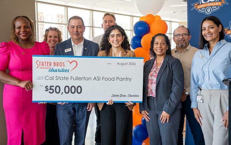 Representatives from Cal State Fullerton, Associated Students Inc. and Stater Bros. Charities present a $50,000 check for the ASI Food Pantry.