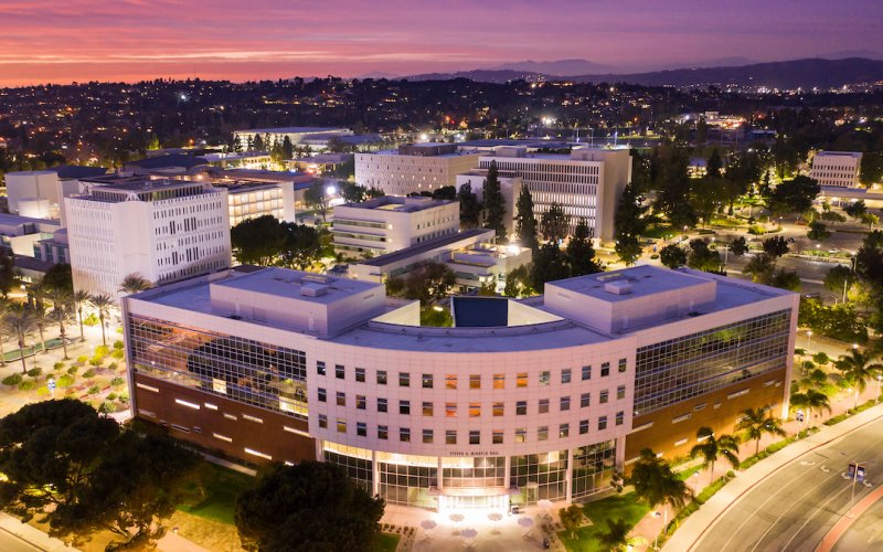 Aerial view of the College of Business and Economics building during sunset