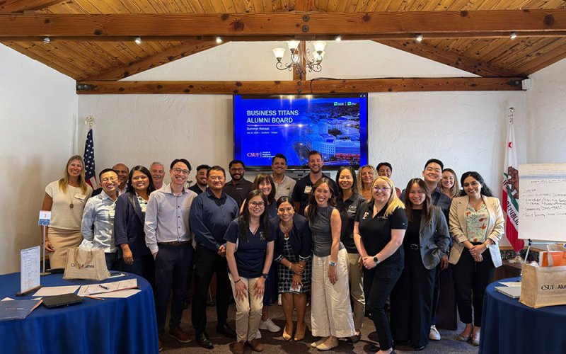 Business Titans Alumni Board members pose for a group photo at the 2026 summer retreat.