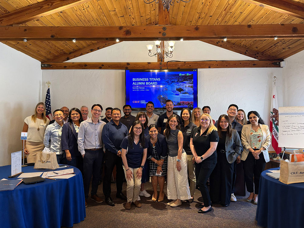 Business Titans Alumni Board members pose for a group photo at the 2026 summer retreat.