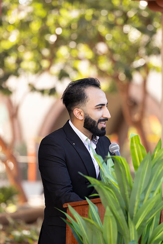 CSUF business student Elyas Khalid speaks at the MOU signing event.