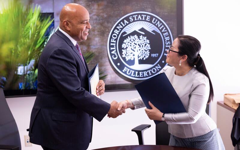 President Rochon and Dr. Tep Kolap, rector of Phnom Penh International University (PPIU) signed a Memorandum of Understanding to open doors for students, faculty
